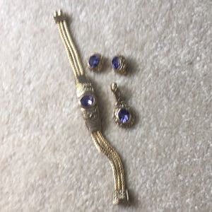 Bracelet earrings and pendant set.